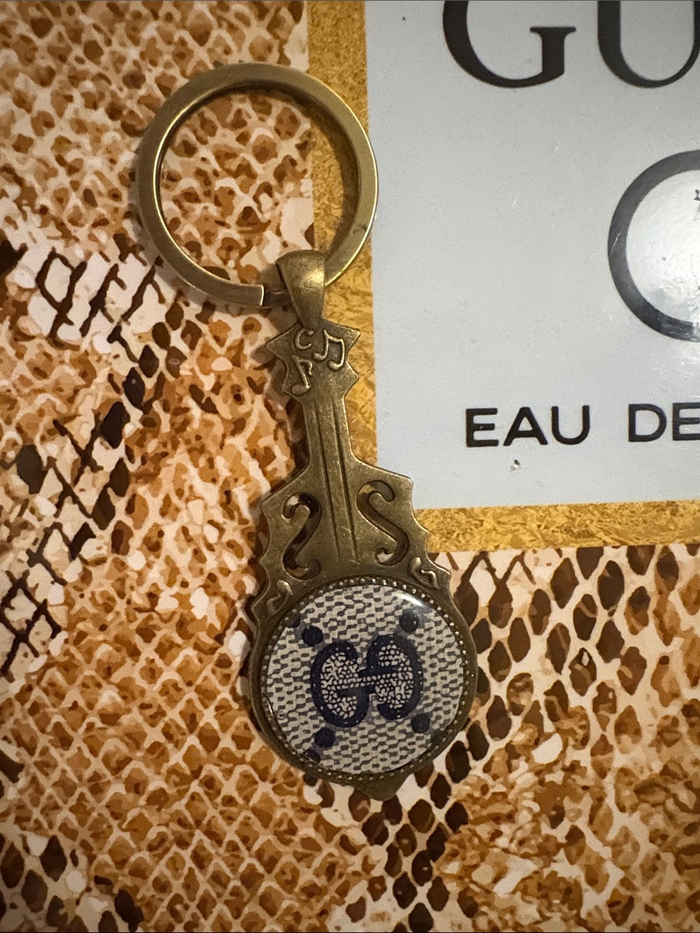 Gucci Brass-Tone Keyring with Blue Monogram Accent